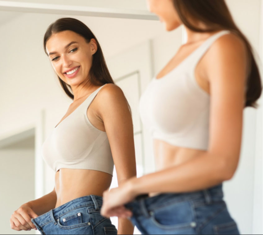 weight loss girl wearing jeans white top